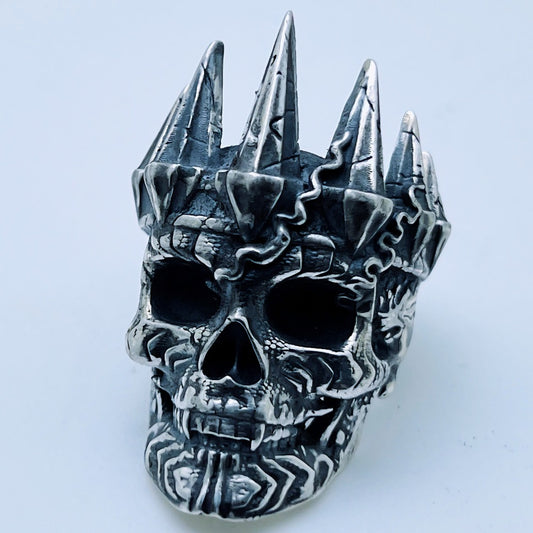 Sterling silver crowned skull ring with spiked crown and dark oxidized details, finished by hand in Morocco – Maison Assam Silver Legends collection