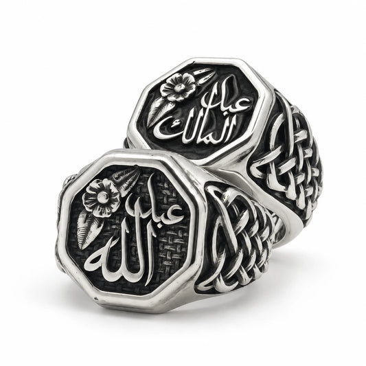 Two octagon sterling silver signet rings with Arabic names, a flower motif and woven knot sides, by Maison Assam